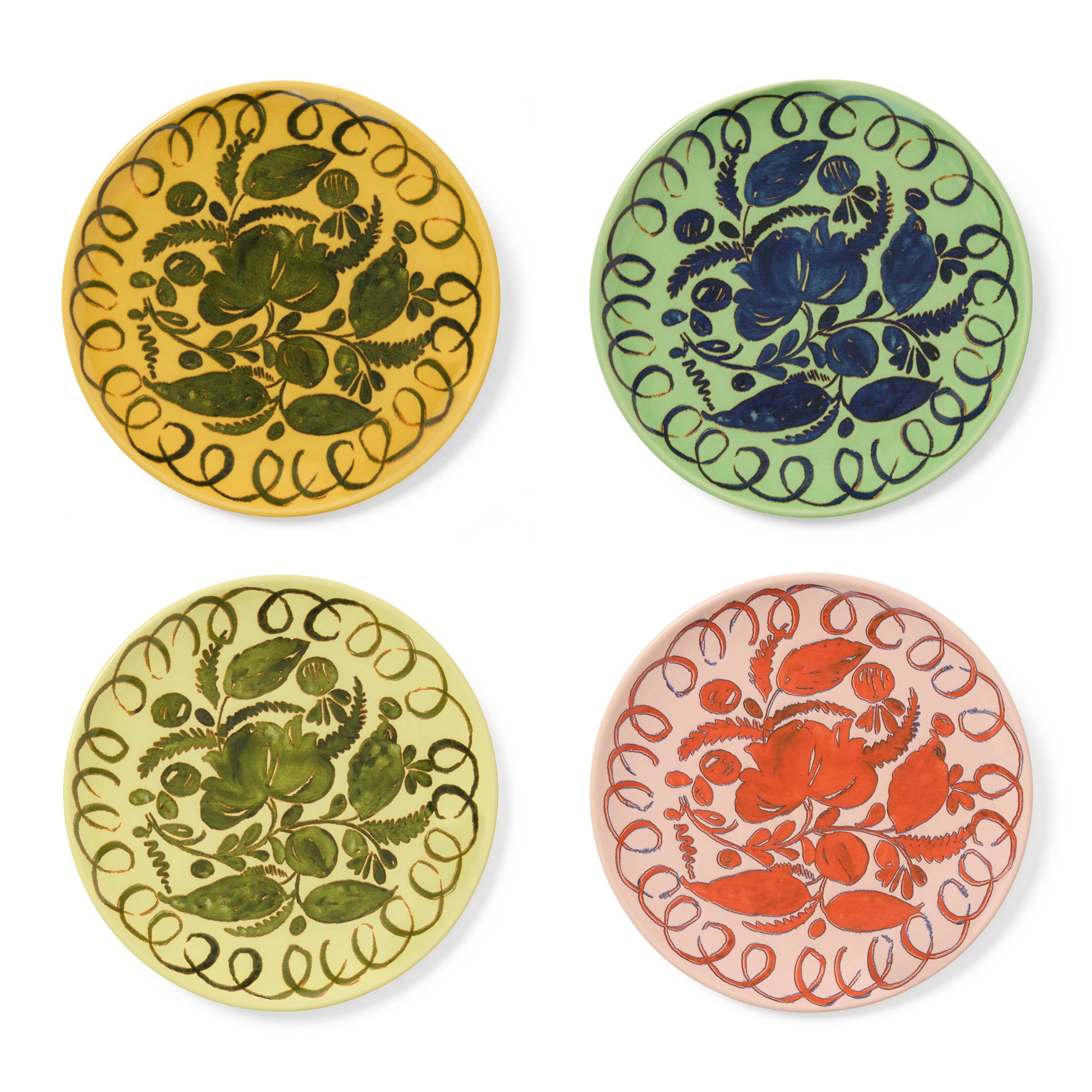 Four circular coasters with floral patterns on a white background