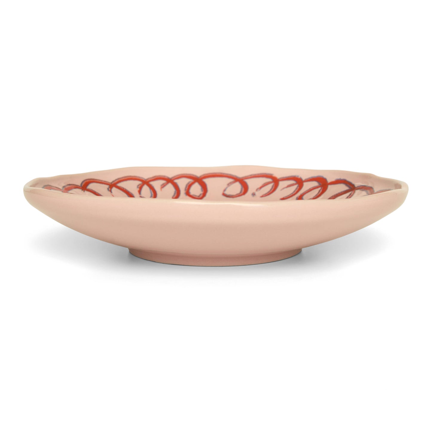 Beige ceramic bowl with red decorative pattern on a white background