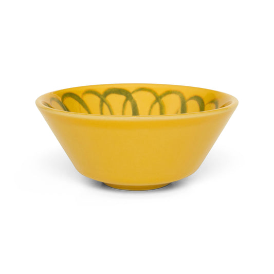 Yellow ceramic bowl with green decorative lines on a white background