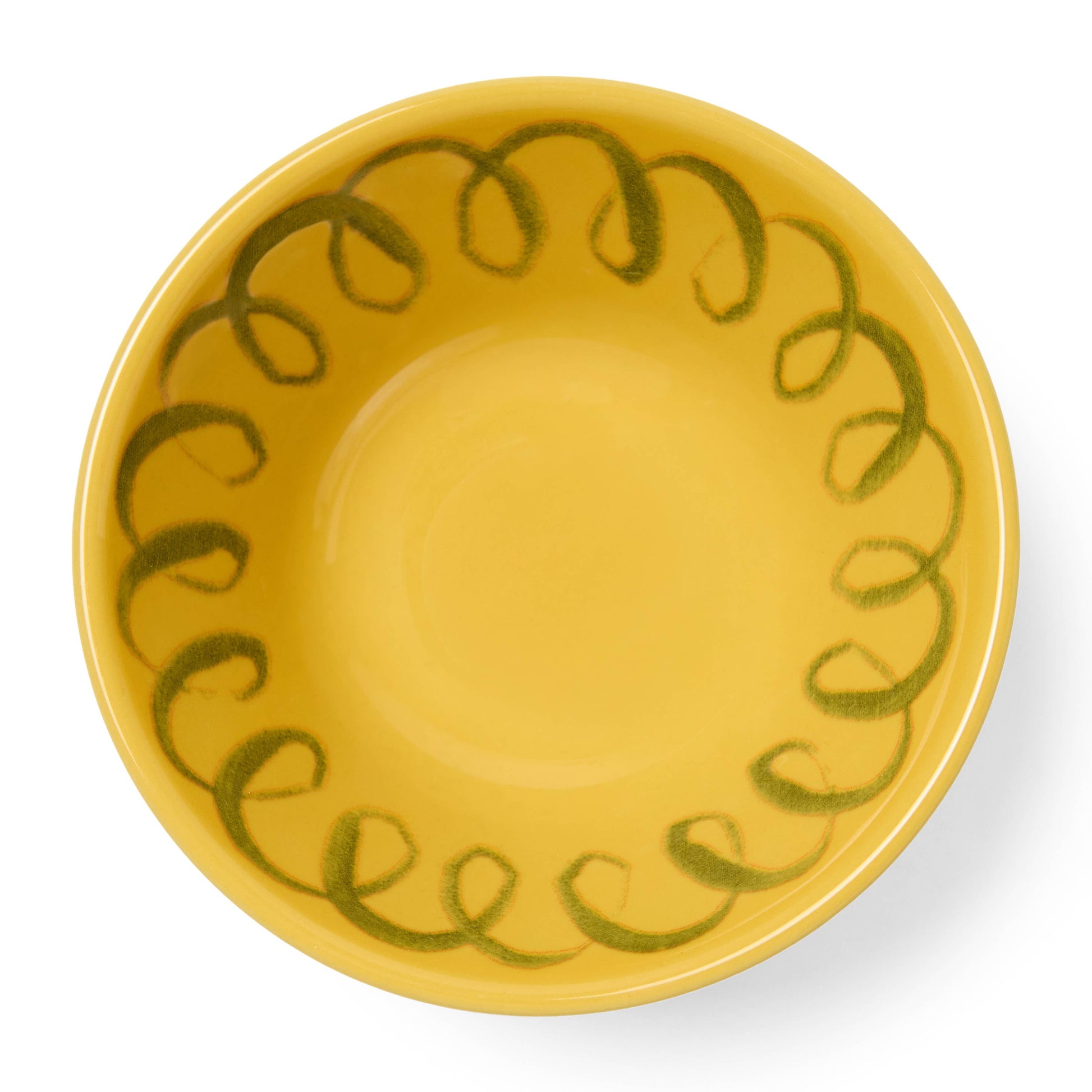 Yellow ceramic bowl with green decorative pattern on a white background