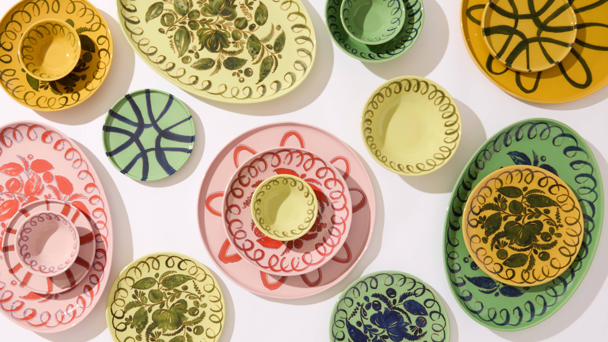 Colorful ceramic plates with various patterns on a white background, Le Marchande