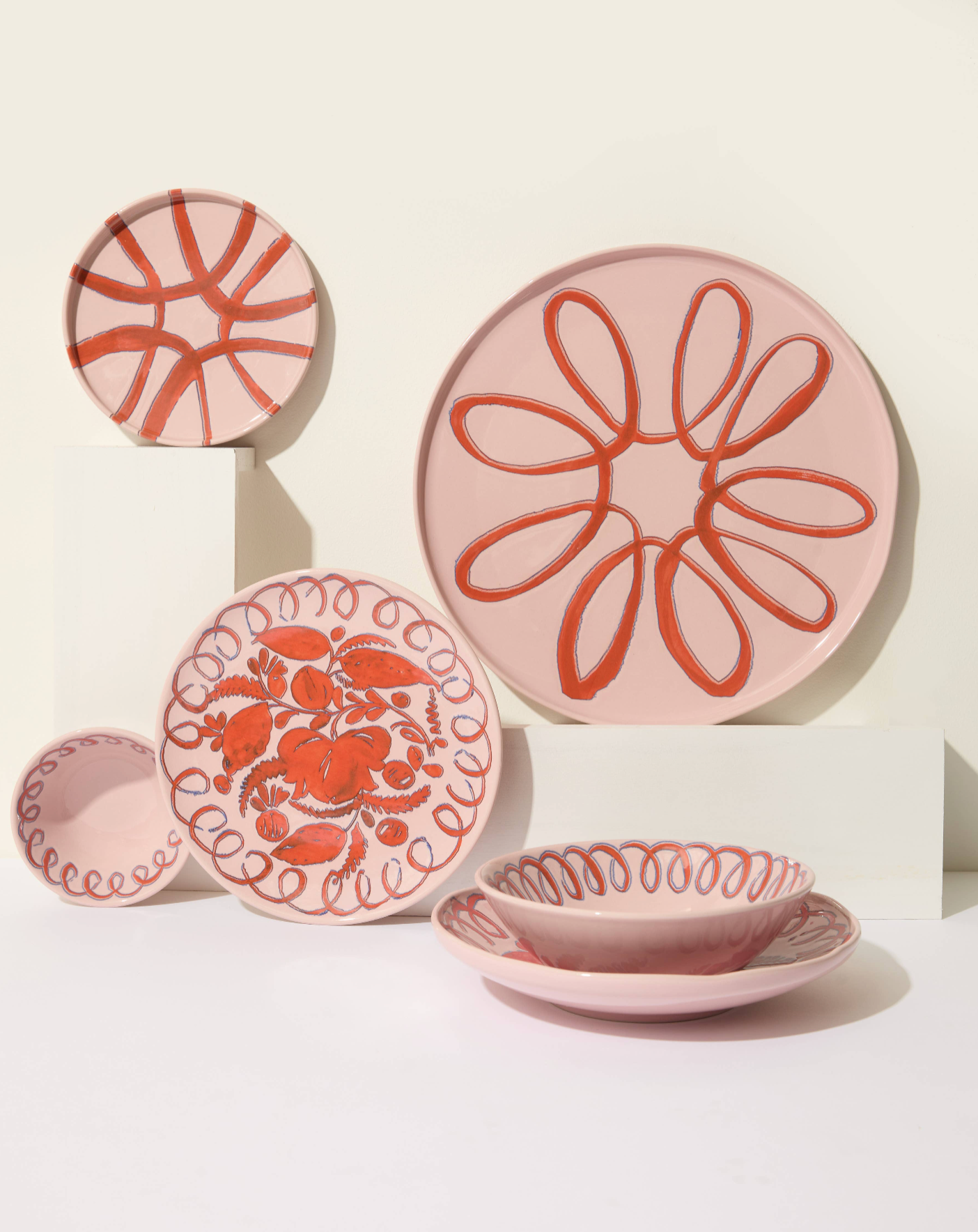 Set of ceramic plates with decorative patterns on a white background