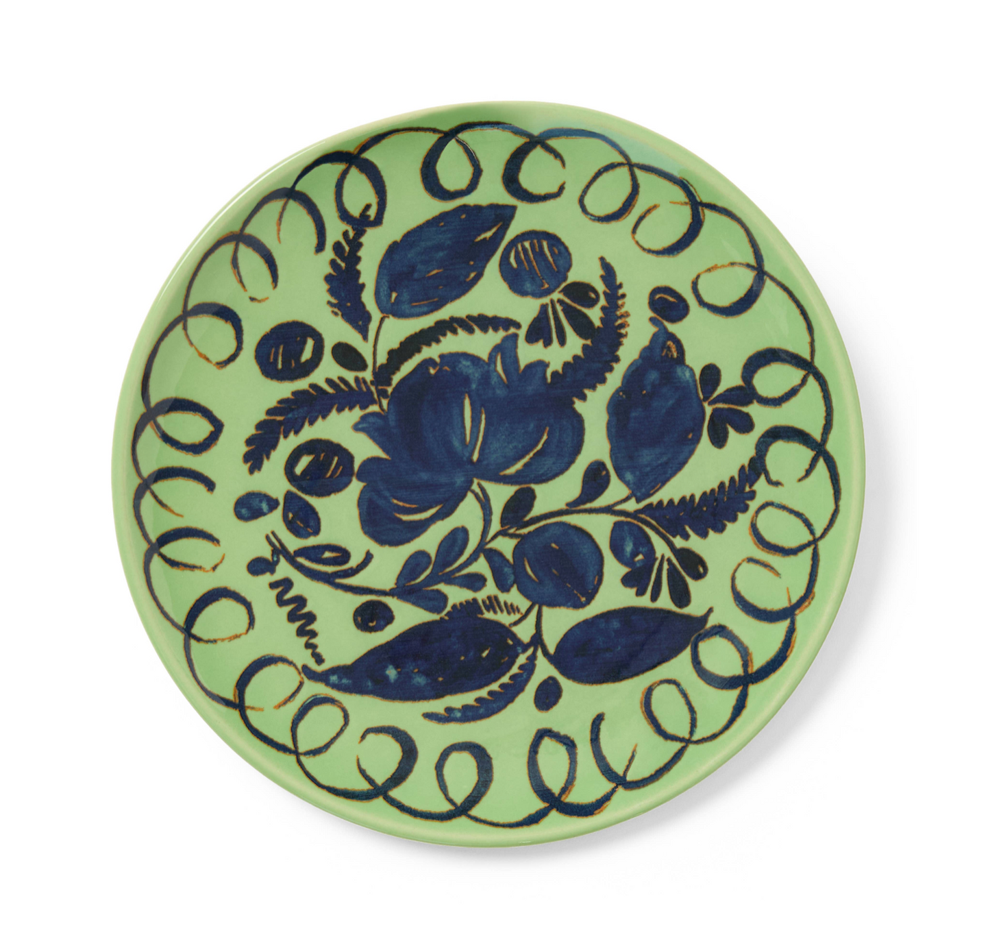 Ceramic plate with blue floral design on a green background