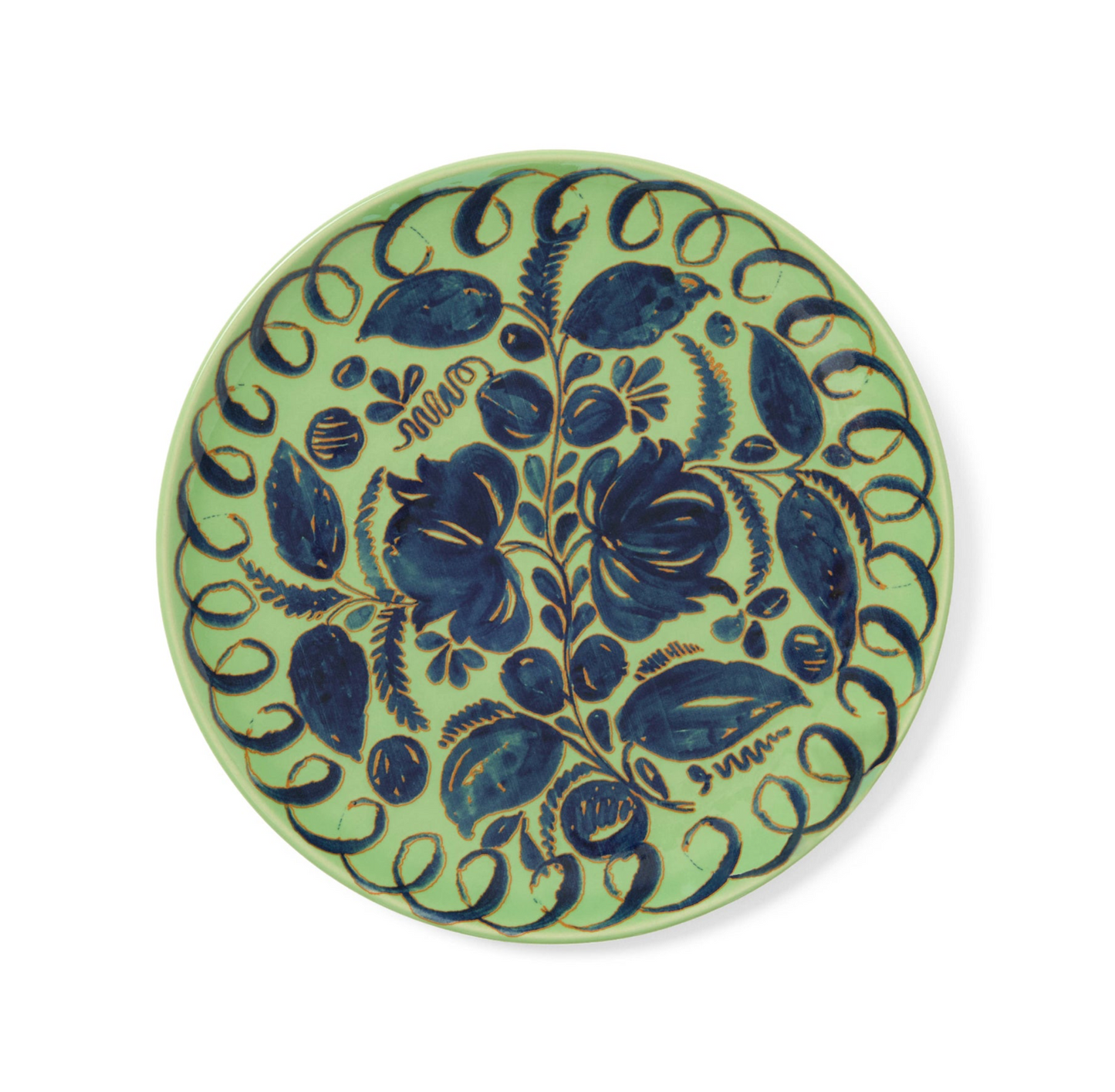 Ceramic plate with blue floral design on a green background