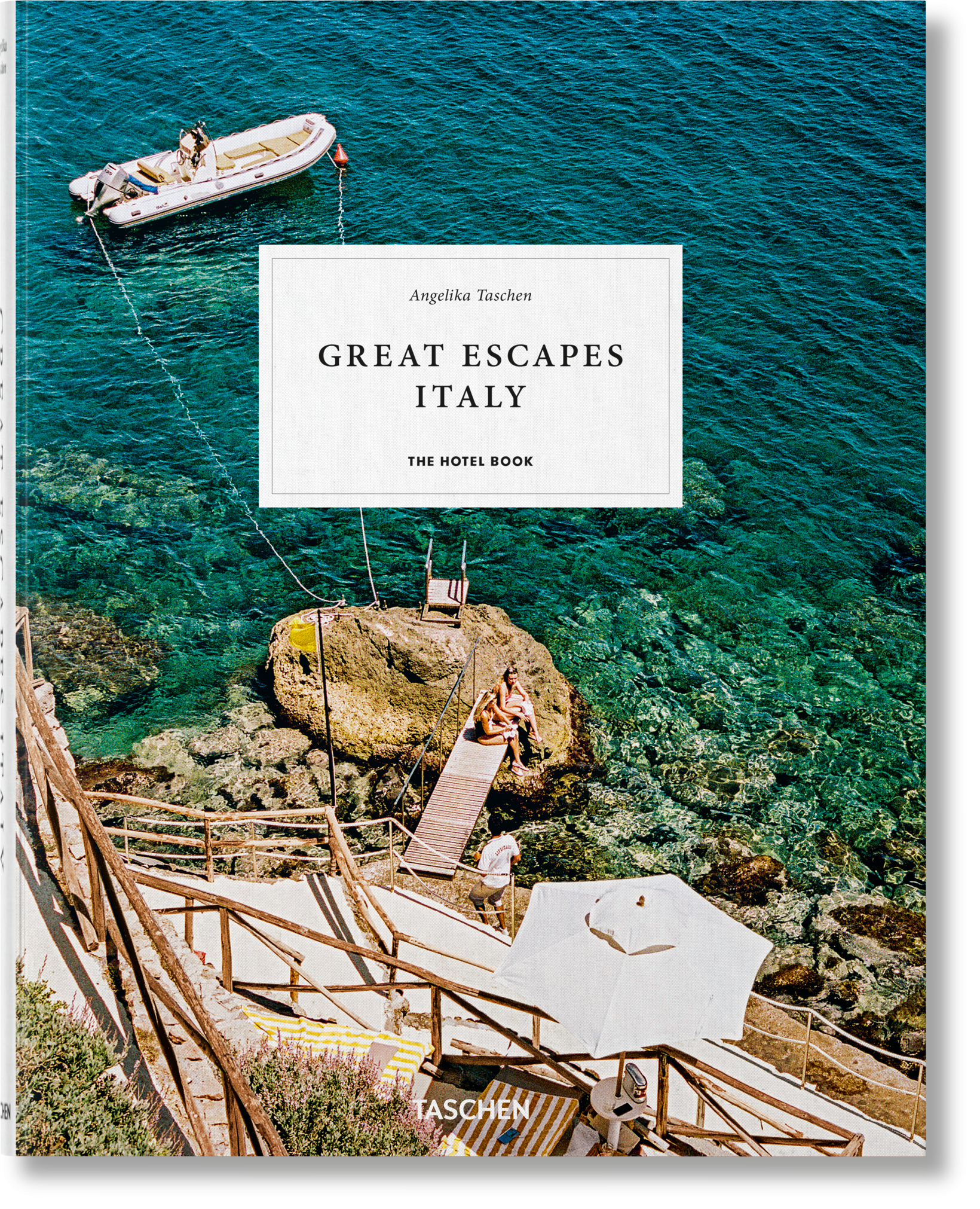 Book titled 'Great Escapes Italy' by Taschen with a scenic view of a boat and cliffside house. Le Marchande