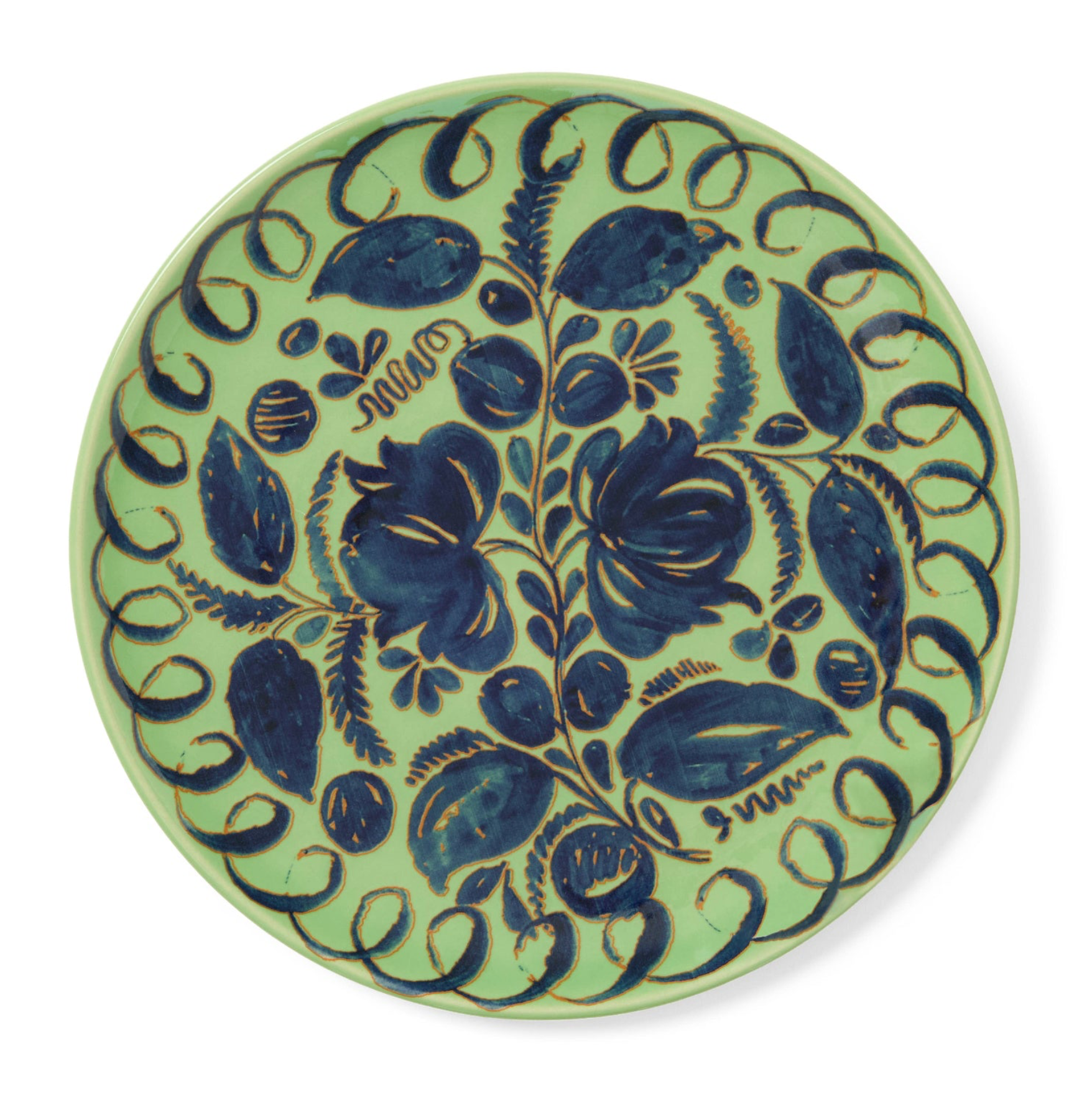 Decorative ceramic plate with blue floral patterns on a light green background