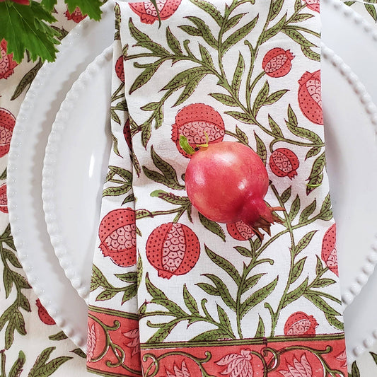 Napkin with pomegranate pattern on a white plate